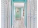 Hallway view into bathroom, showing bathtub and sink at 521 Pinellas Bayway S # 301, St Petersburg, FL 33715