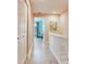 Charming hallway with an open doorway, closet, and a coastal-themed painting at 521 Pinellas Bayway S # 301, St Petersburg, FL 33715