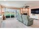 Cozy living room with fireplace, tile flooring, sliding glass doors to the outside, and comfortable seating at 521 Pinellas Bayway S # 301, St Petersburg, FL 33715