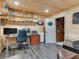 Bright office space featuring wood paneled walls and a door to storage at 521 Pinellas Bayway S # 301, St Petersburg, FL 33715