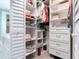 Well-organized walk-in closet with custom shelving, drawers, and ample storage space at 521 Pinellas Bayway S # 301, St Petersburg, FL 33715