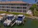 Tranquil waterfront view of condos and boat docks, ideal for boating and enjoying waterfront living at 521 Pinellas Bayway S # 301, St Petersburg, FL 33715