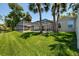 Screened-in pool area overlooking backyard and scenic pond at 5242 Venice Ne Way, St Petersburg, FL 33703