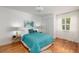 Cozy bedroom with hardwood floors, a bright window, and closet at 5242 Venice Ne Way, St Petersburg, FL 33703