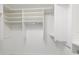 Bright walk-in closet with adjustable shelving and hanging rods at 5242 Venice Ne Way, St Petersburg, FL 33703