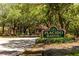 Entrance to Placido Bayou features lush landscaping and mature oak trees, giving a sense of old Florida at 5242 Venice Ne Way, St Petersburg, FL 33703