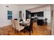 Dining room leading to the modern kitchen with stainless steel appliances and granite countertops at 5242 Venice Ne Way, St Petersburg, FL 33703