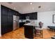Modern kitchen featuring stainless steel appliances, granite countertops, and a breakfast bar at 5242 Venice Ne Way, St Petersburg, FL 33703