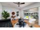 Living room features a wine cellar decor, hardwood floors, and sliding glass doors to the screened lanai and pool at 5242 Venice Ne Way, St Petersburg, FL 33703