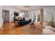 Open-concept living room with wood floors and a view of the modern kitchen at 5242 Venice Ne Way, St Petersburg, FL 33703