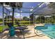 Enjoy the screened-in pool overlooking the pond and neighborhood from the comfort of lounge chairs at 5242 Venice Ne Way, St Petersburg, FL 33703