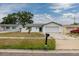 Pleasant home exterior with two-car garage, small tree, and inviting curb appeal at 564 5Th Se Ave, Largo, FL 33771