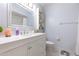 Bathroom with a white vanity and a large mirror at 5666 Gardens Dr # 202, Sarasota, FL 34243
