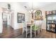 Dining area with a decorative mirror and a chandelier at 5666 Gardens Dr # 202, Sarasota, FL 34243
