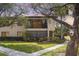 Two-story condo with landscaped lawn and garden at 5666 Gardens Dr # 202, Sarasota, FL 34243