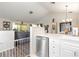 Open-concept kitchen with stainless steel appliances and white cabinets at 5666 Gardens Dr # 202, Sarasota, FL 34243