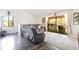Bright living room with sliding glass doors to a screened-in patio at 5666 Gardens Dr # 202, Sarasota, FL 34243