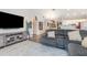 Cozy living room features modern furnishings and wood flooring at 5666 Gardens Dr # 202, Sarasota, FL 34243