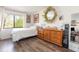 Light-filled bedroom features wood floors and ample natural light at 5666 Gardens Dr # 202, Sarasota, FL 34243