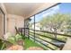 Inviting screened patio features outdoor seating with a view, perfect for relaxing and enjoying the surroundings at 5666 Gardens Dr # 202, Sarasota, FL 34243