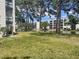 Backyard view of condo buildings overlooking a lake and fountain at 5970 80Th N St # 204, St Petersburg, FL 33709