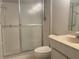 Bright bathroom featuring a shower with glass doors and a neutral-toned vanity at 5970 80Th N St # 204, St Petersburg, FL 33709