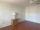 Bedroom showcasing laminate floors and a window with a park-like outdoor view at 5970 80Th N St # 204, St Petersburg, FL 33709