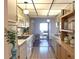 Well-lit kitchen with appliances, cabinets, and a view to the outside at 5970 80Th N St # 204, St Petersburg, FL 33709