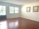 Inviting living room featuring hardwood floors, a window, and neutral walls at 5970 80Th N St # 204, St Petersburg, FL 33709