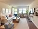 Bright living room featuring a comfortable sofa, wood coffee table, and modern decor at 5970 80Th N St # 204, St Petersburg, FL 33709