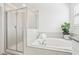 This elegant bathroom features a separate shower, a soaking tub, and granite countertops at 6398 Bar S Bar Trl, Zephyrhills, FL 33541