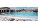 Resort-style pool with lounge chairs and luxurious amenities for ultimate relaxation and enjoyment at 6398 Bar S Bar Trl, Zephyrhills, FL 33541