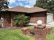 All brick home featuring a manicured lawn, brick mailbox, and two car garage at 6533 Brentwood Dr, Zephyrhills, FL 33542