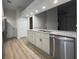 Kitchen with stainless steel appliances, white cabinets, and granite countertops at 6533 Brentwood Dr, Zephyrhills, FL 33542
