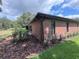 All brick single story home with a well-manicured lawn and landscape at 6533 Brentwood Dr, Zephyrhills, FL 33542