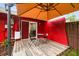 Inviting backyard deck with colorful outdoor furniture, providing a relaxing space for outdoor enjoyment and entertaining at 6703 Towhe Dr, Seffner, FL 33584