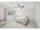Bright bedroom with a window view, neutral color palette, and ample natural light at 6703 Towhe Dr, Seffner, FL 33584