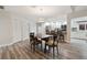 Dining space between a kitchen and a hallway featuring wood-look floors at 6703 Towhe Dr, Seffner, FL 33584