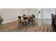 Dining area between two sets of closet doors, next to a hallway and a laundry room at 6703 Towhe Dr, Seffner, FL 33584