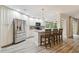 Modern kitchen with stainless steel appliances, granite countertops, and eat-in island at 6703 Towhe Dr, Seffner, FL 33584