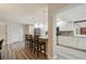 Eat-in kitchen featuring stainless steel appliances, granite countertops, and barstool seating at 6703 Towhe Dr, Seffner, FL 33584