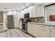 Bright kitchen with white cabinetry, stainless steel appliances, and granite countertops at 6703 Towhe Dr, Seffner, FL 33584