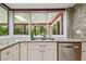 Kitchen sink with granite countertops, stainless steel appliances and a view to the outside at 6703 Towhe Dr, Seffner, FL 33584
