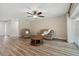 Comfortable living room featuring vinyl floors, ceiling fan and access to the outdoors at 6703 Towhe Dr, Seffner, FL 33584