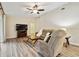 Spacious living room featuring a comfortable sofa and a ceiling fan at 6703 Towhe Dr, Seffner, FL 33584