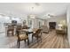 Living space with a dining table, chairs, and a partial view of a modern kitchen at 6703 Towhe Dr, Seffner, FL 33584