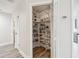 Walk-in pantry features floor-to-ceiling shelving providing ample storage space at 6703 Towhe Dr, Seffner, FL 33584