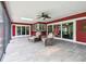 Relax in this sunroom with a ceiling fan, tiled floors, and a view of the outdoors at 6703 Towhe Dr, Seffner, FL 33584