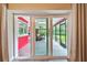 Bright sunroom with sliding glass doors to the outside and wood look flooring at 6703 Towhe Dr, Seffner, FL 33584