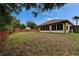 Expansive backyard with screen porch, perfect for outdoor activities and relaxation at 6801 Bishops Pointe Way, Riverview, FL 33578